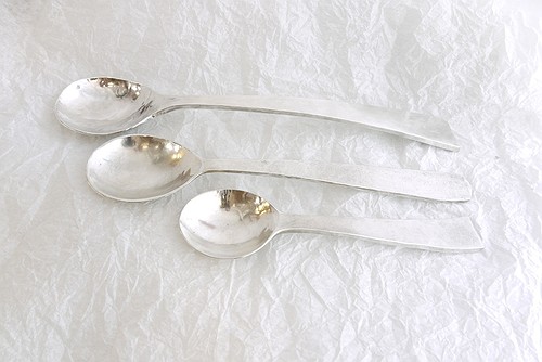 Three silver spoons